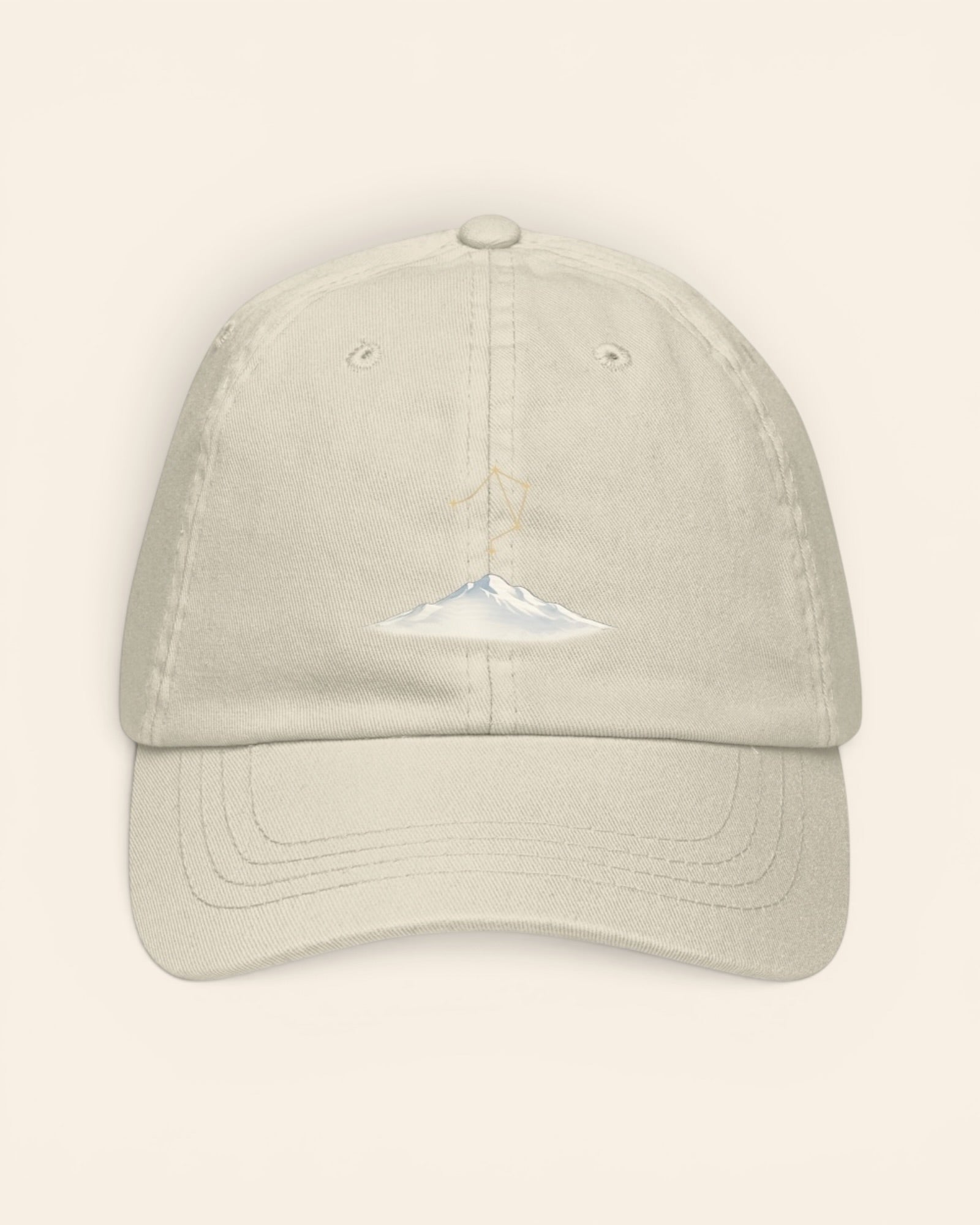 Libra constellation hat with embroidered stars above a mountain ridge, in Beige