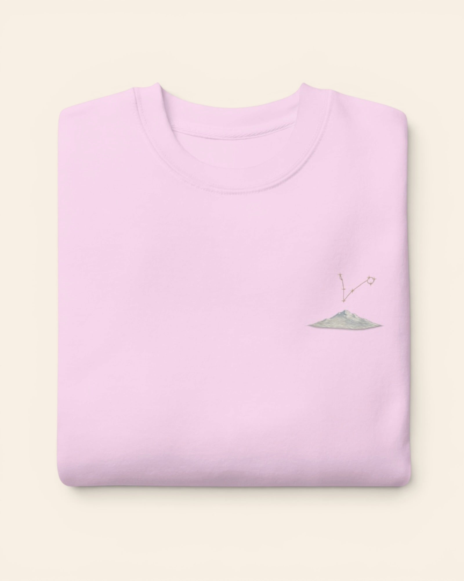 Pisces constellation crewneck sweatshirt with embroidered stars above a mountain ridge, in Lavender