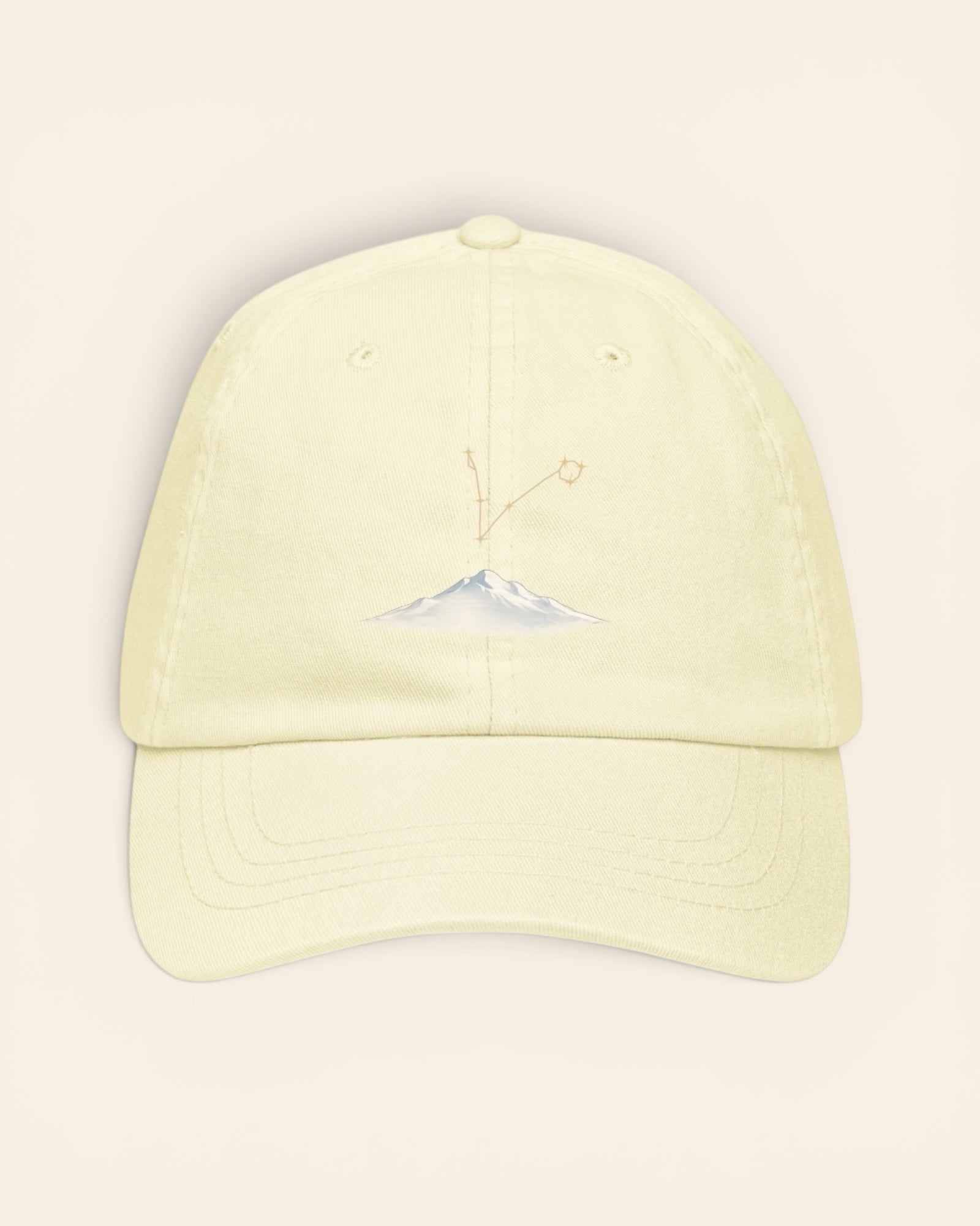 Pisces constellation hat with embroidered stars above a mountain ridge, in Pastel Lemon