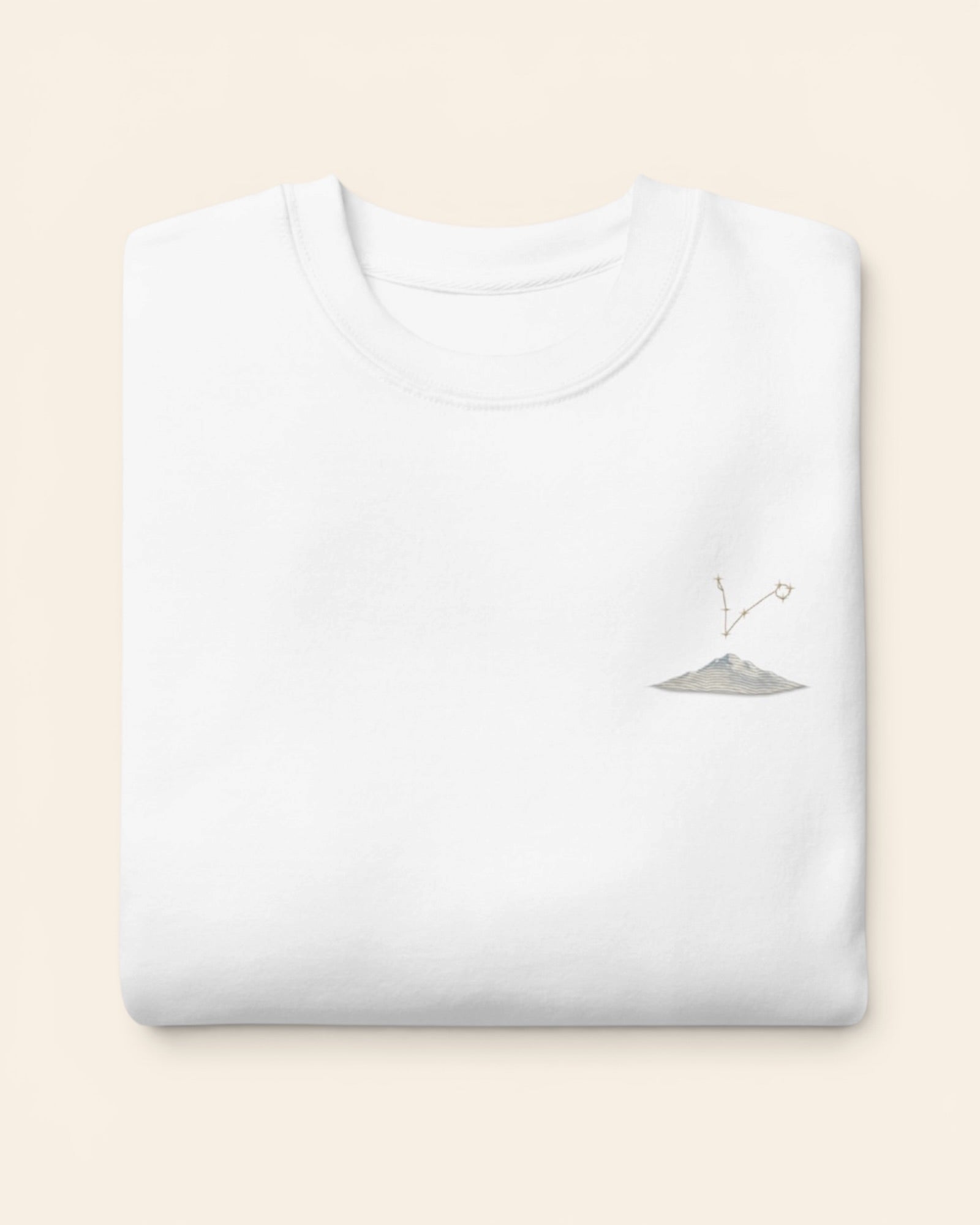 Pisces constellation crewneck sweatshirt with embroidered stars above a mountain ridge, in White