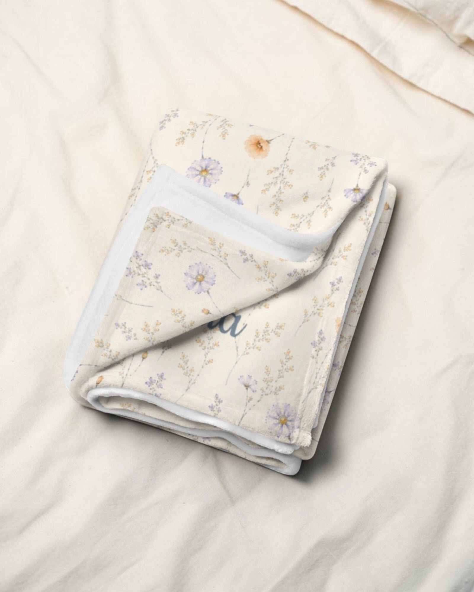 Garden Reverie Throw Blanket, with peach poppies, blue cosmos, forget-me-nots, and daisies print