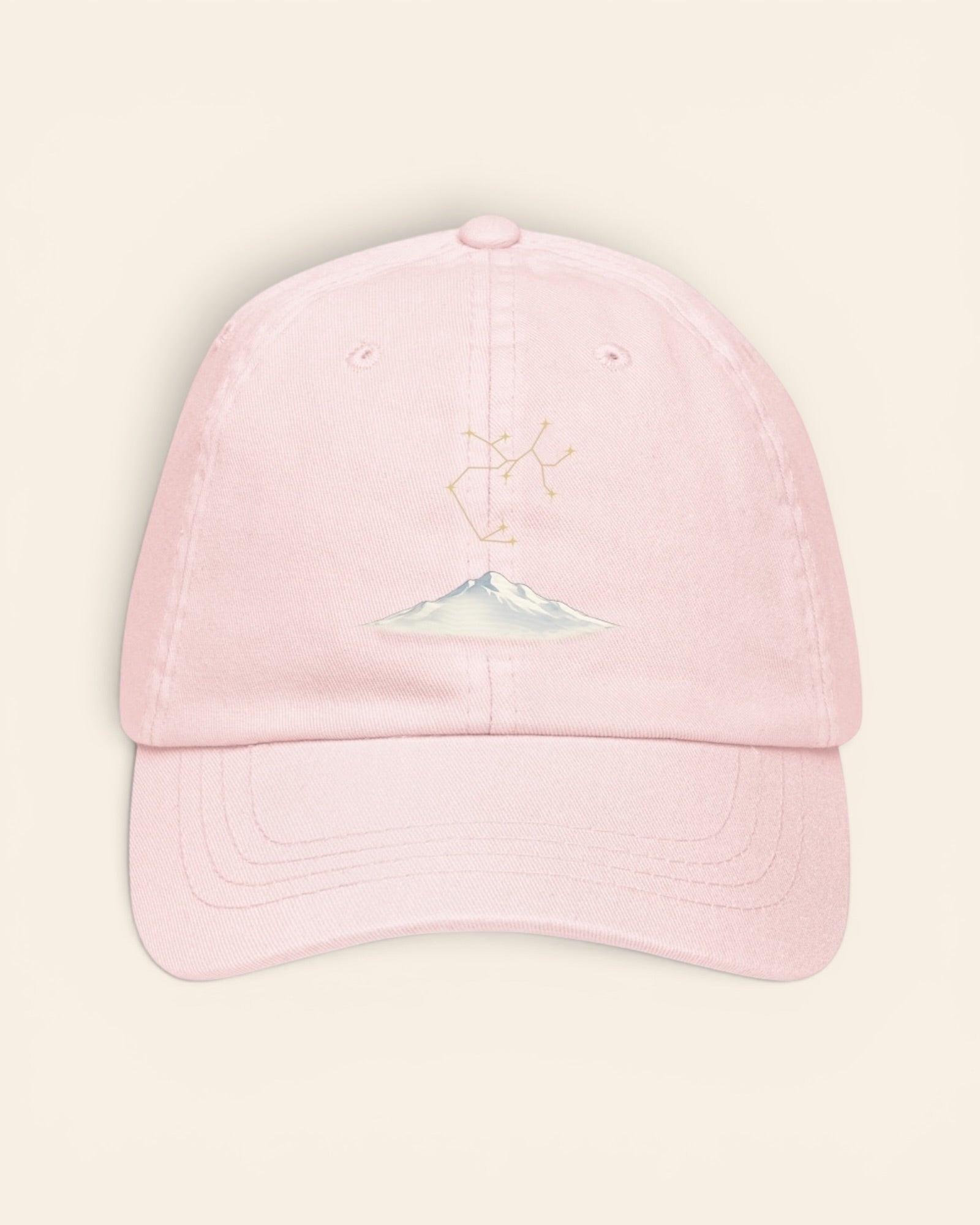 Sagittarius constellation hat with embroidered stars above a mountain ridge, in Pastel Pink