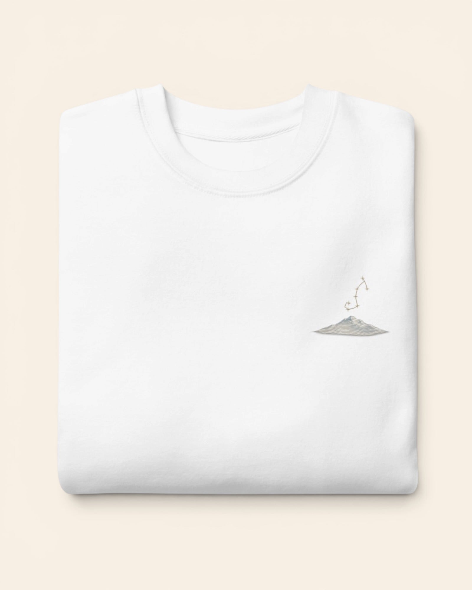 Scorpio constellation crewneck sweatshirt with embroidered stars above a mountain ridge, in White