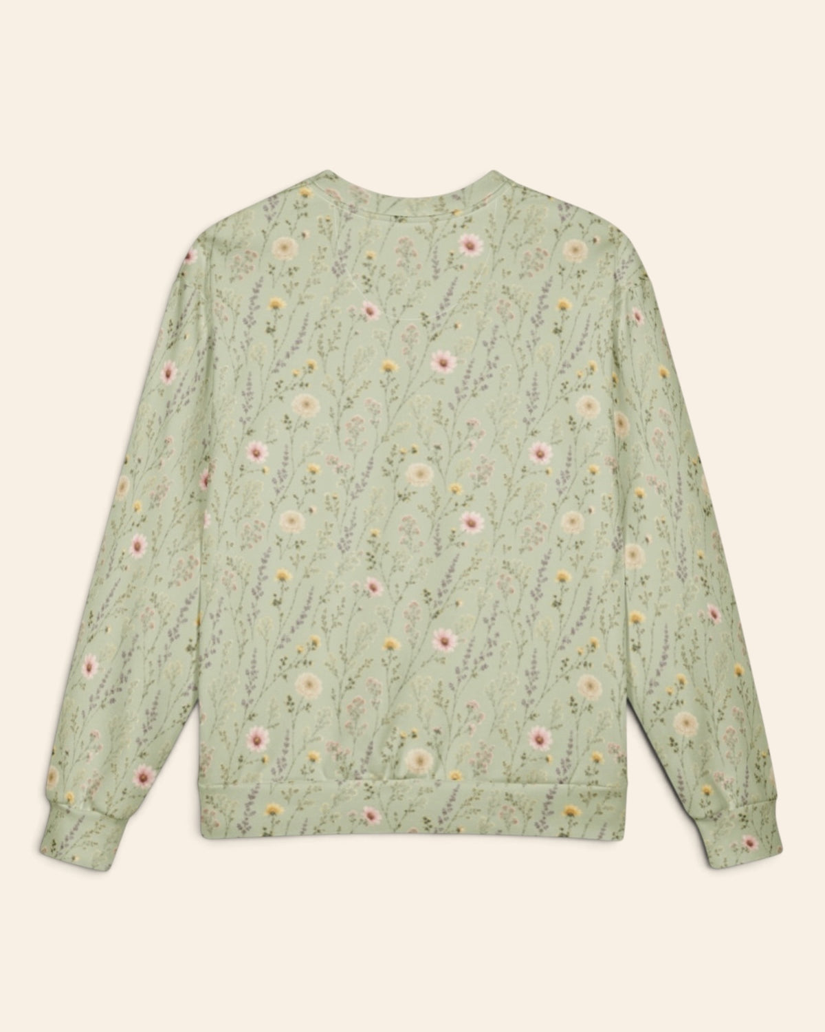 The same crewneck shown flat from the back on a plain cream background, with no text, so the all-over print runs unbroken across the body and sleeves. It is sage green, printed with white and pink daisies and fine wildflower stems.