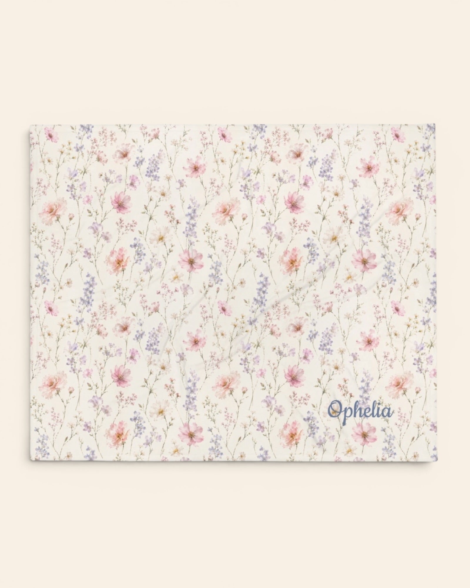 The Wildflower Theory Throw Blanket, with blush cosmos, cottage roses, larkspur, and baby's breath print