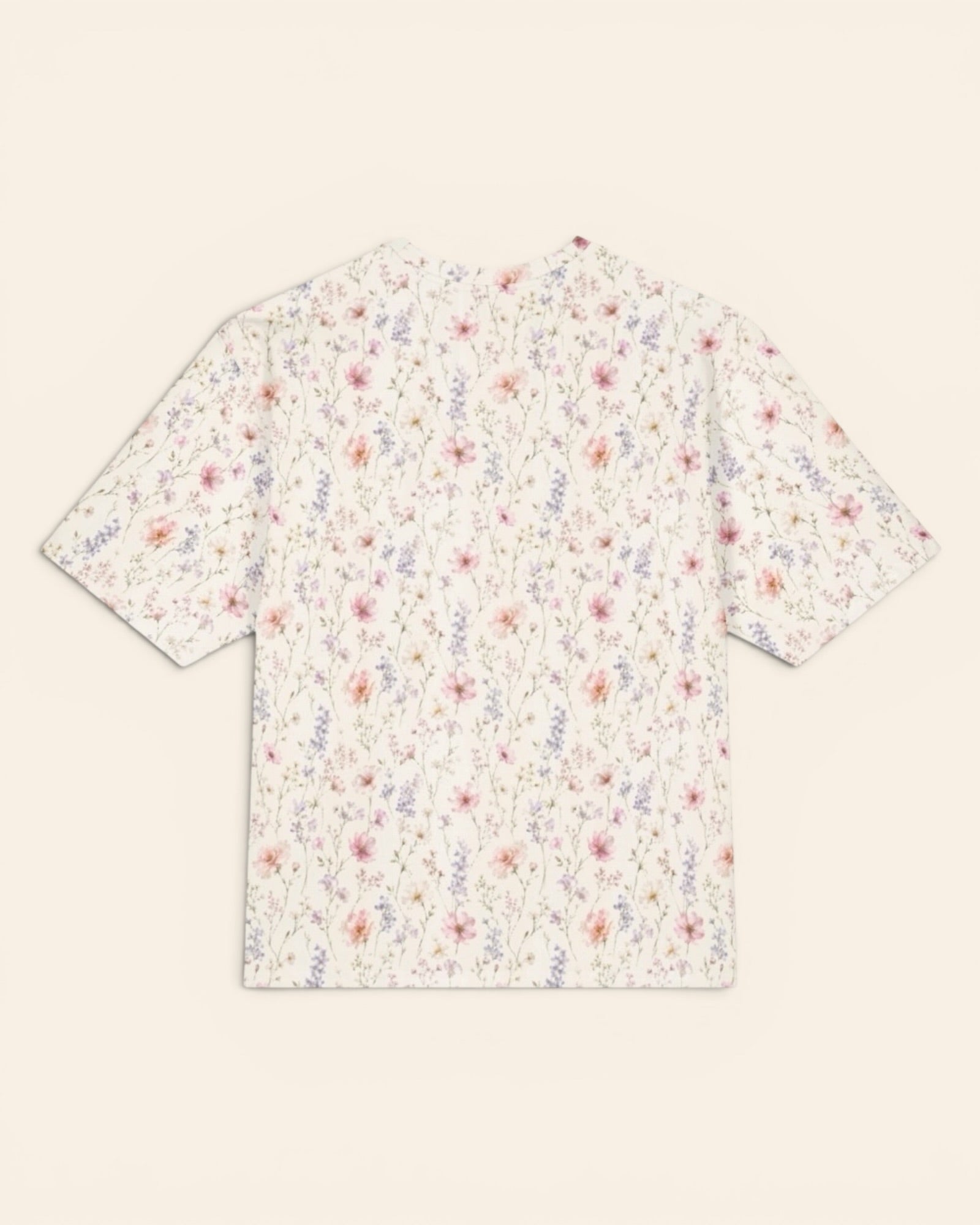 The Wildflower Theory Oversized Tee, with blush cosmos, cottage roses, larkspur, and baby's breath print