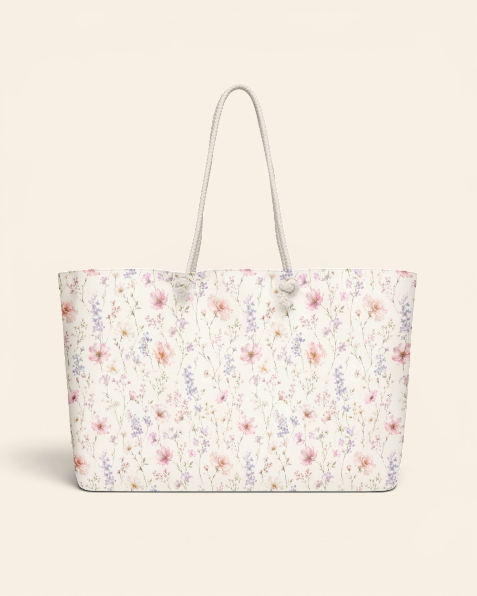 The Wildflower Theory Weekender Bag, with blush cosmos, cottage roses, larkspur, and baby's breath print