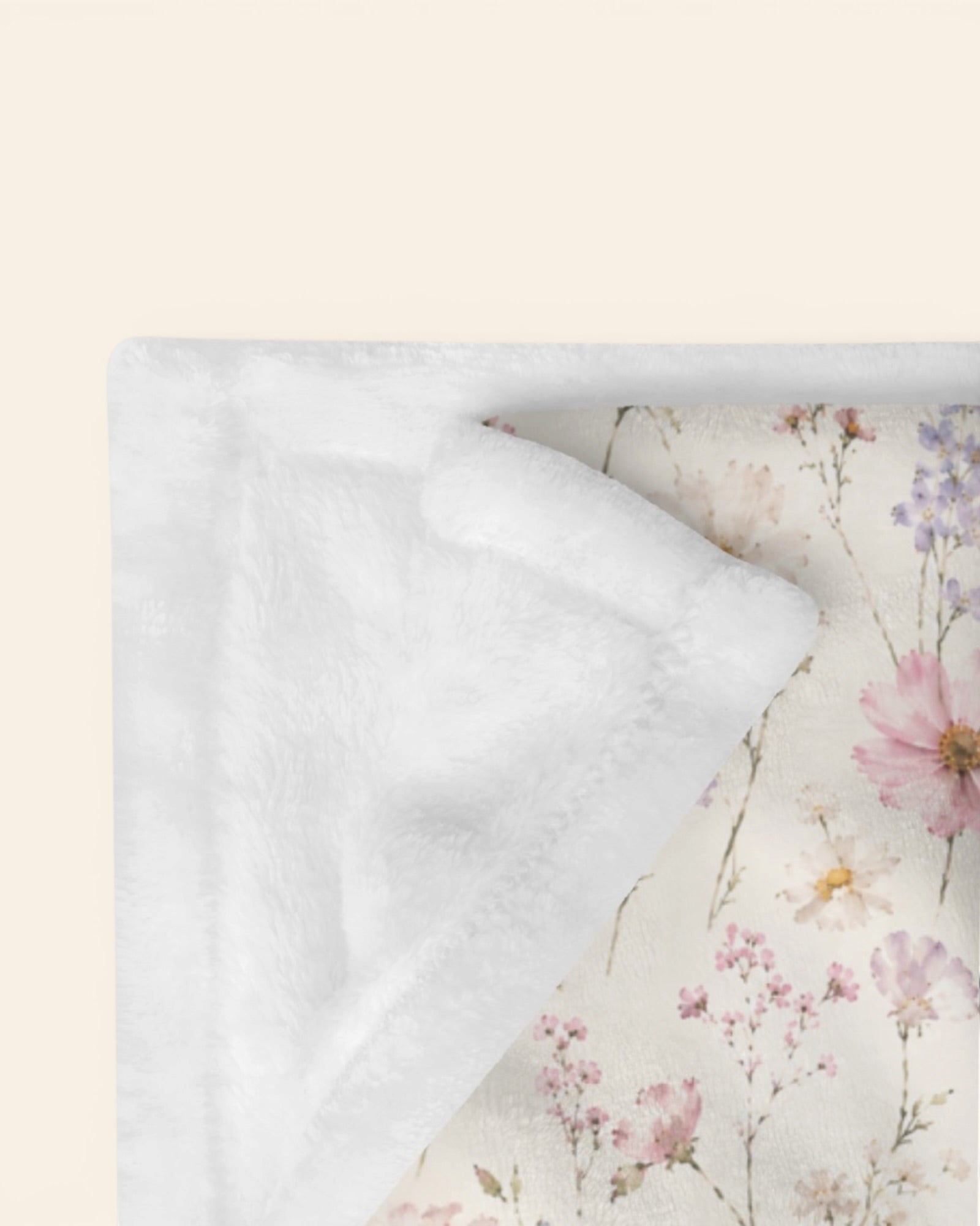 The Wildflower Theory Throw Blanket, with blush cosmos, cottage roses, larkspur, and baby's breath print