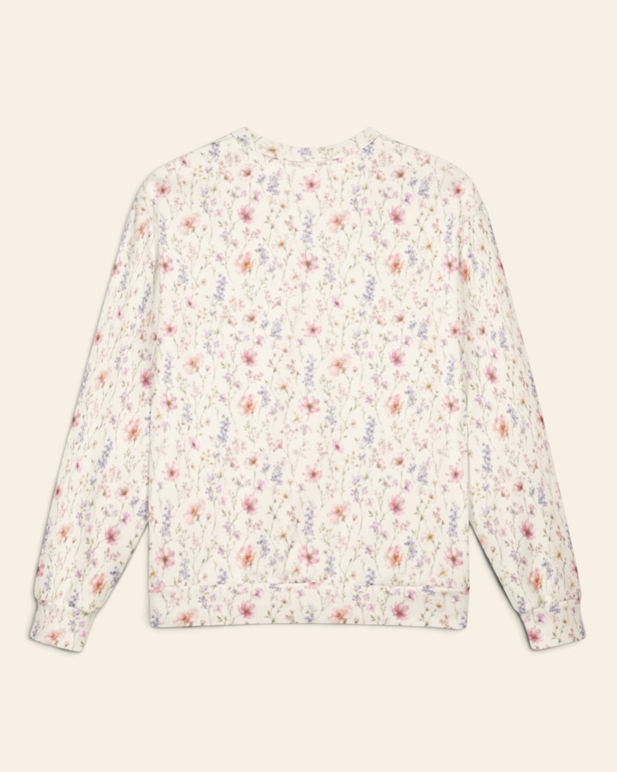 The same crewneck shown flat from the back on a plain cream background, with no text, so the all-over print runs unbroken across the body and sleeves. It is white, densely printed with blush cosmos and lilac and periwinkle wildflowers.